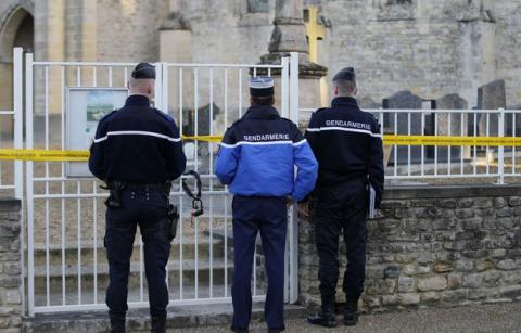 20150218-HP 648x415_french-gendarmes-stand-in-front-of-a-fence-bearing-a-cordon-reading-national-gendarmerie-forbidden.jpg