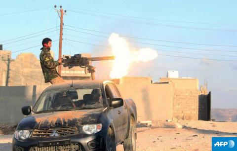 20150218-LB un_combattant_de_fajr_libya_lors_de_combats_au_sud_ouest_de_tripoli_le_21_octobre_2014._mohammed_turkia-afp.jpg
